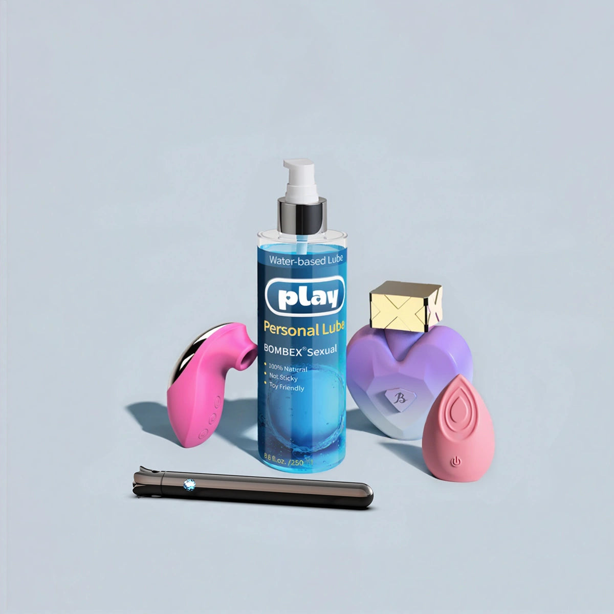 Water based lube placed with sex toys to show compatibility, natural lubricant safe and smooth, best lube for sex and best lube for sex toys